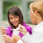 businesswomen eating yogurt