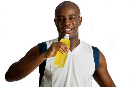 Athlete With Energy Drink Sports drinks containing fructose enhance exercise recovery, study reports.